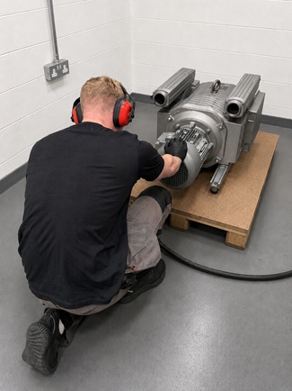 Engineer testing a Becker VTLF vacuum pump