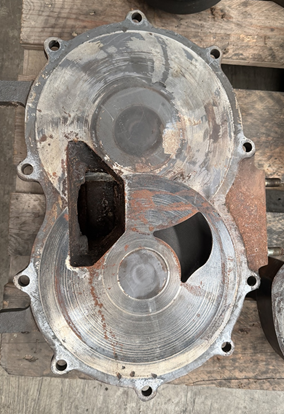 Worn vacuum pump end plate before refurbishment